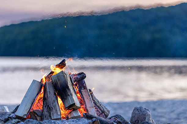 Summer Campfire and Lake at sunset filmed in super slow motion