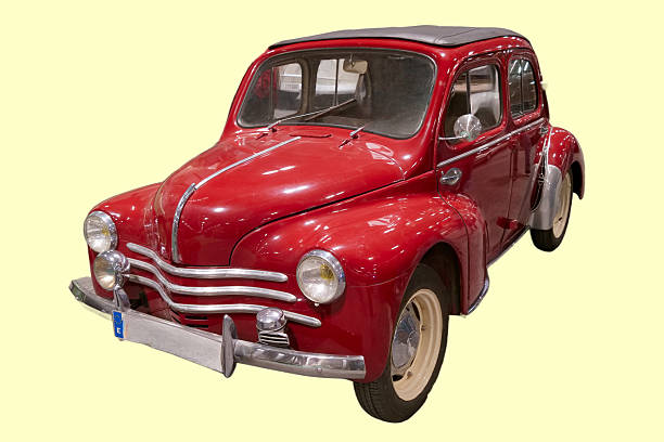 Rusty classic Warszawa M20 car from the 1950s in an exhibition hall. Iconic communist-era vehicle in original condition with visible corrosion.
