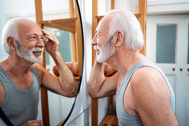 Senior Man Doing Morning Routine in Bathroom