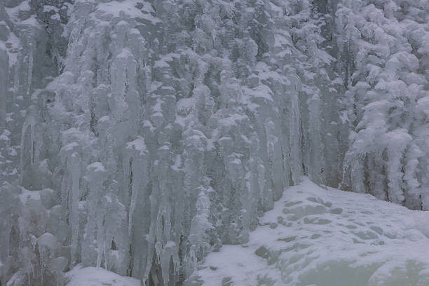 Icicles hanging on a rock in winter