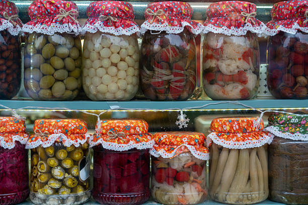 Assorted Homemade Pickles in Glass Jars on Retail Display