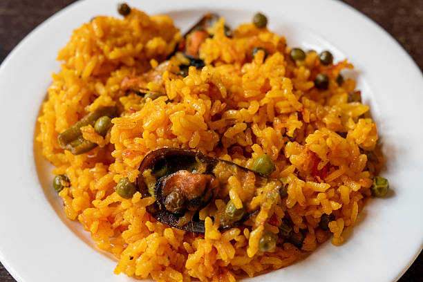 Shellfish with yellow rice , on a plate