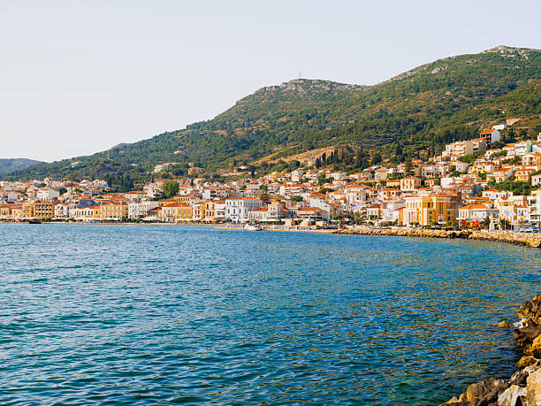 A tranquil view of the Aegean coastline on Samos Island, Greece, featuring clear blue sea, natural shoreline, and Mediterranean summer atmosphere.
