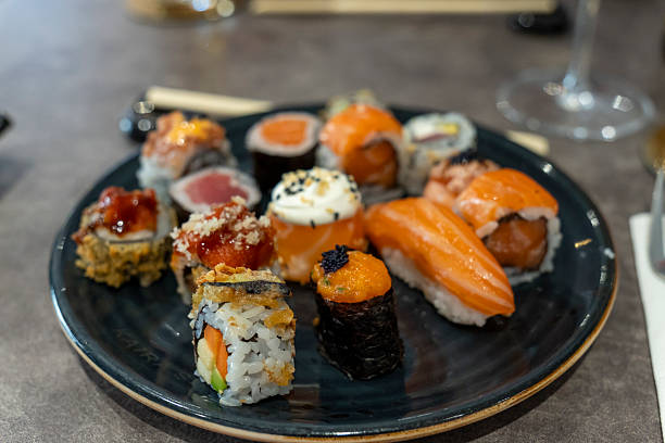 Gourmet seafood plate with maki sushi variation Oriental restaurant