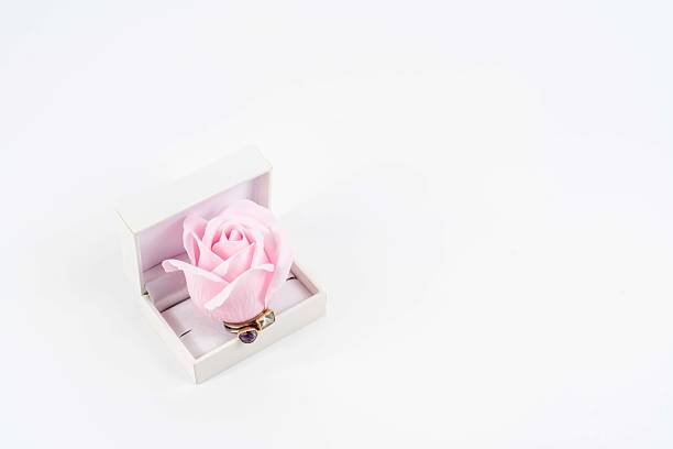 Pink and White Roses with Engagement and Wedding Ring