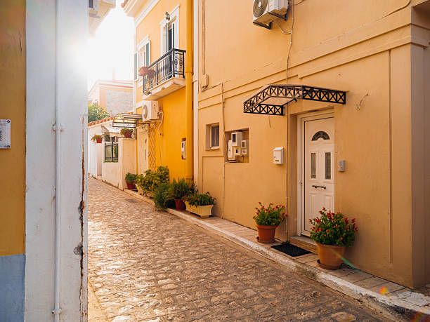 Colorful waterfront houses and traditional harbor views in Pythagoreio, a historic coastal town on Samos Island in the Aegean Sea, Greece. Clear summer skies, calm waters, and Mediterranean architecture reflect the island’s cultural heritage and relaxed seaside atmosphere.