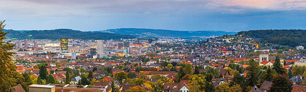 Zurich, Switzerland downtown city skyline with modern high rises at twilight.