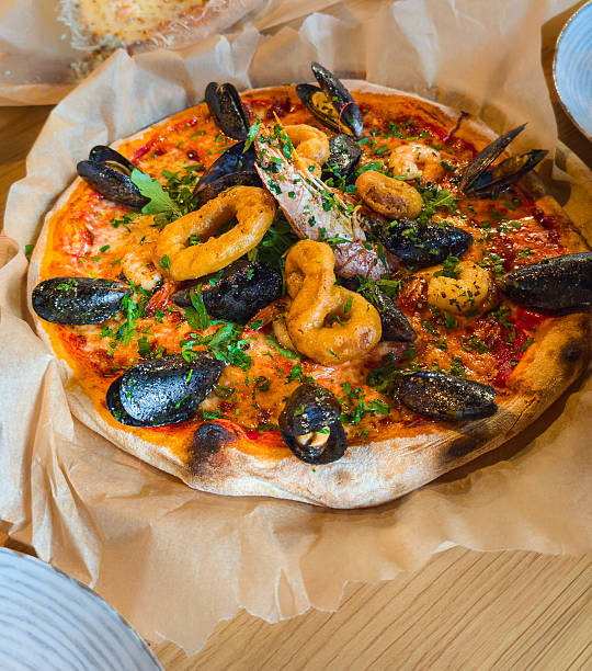 Pizza seafood in box close up.