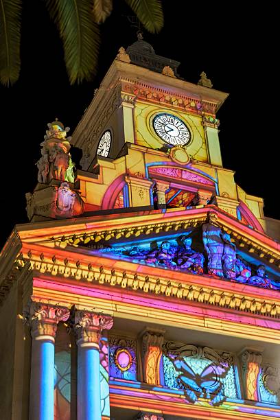 Malaga, Spain; December 29, 2025: Malaga City Hall illuminated with colorful Christmas light projections at night. Festive holiday decoration highlighting historic architecture in southern Spain
