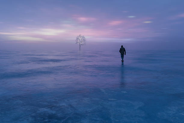 Man walking in surreal winter landscape. 3D generated image.
