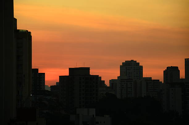 Beautiful sunset landscape photography featuring golden hour sky with warm orange and red tones. Scenic nature scenes with tree silhouettes against vibrant sunset sky. Perfect for travel, nature, and environmental design projects. Stunning natural light photography capturing the beauty of dusk and evening sky.