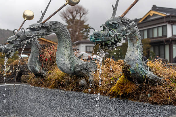 31 march 2019 - Takayama, Japan: dragon purification fountain at Sakurayama Hachimangu Shrine in Takayama