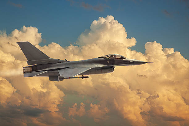 istock F-16 Flying Falcon jet model flies among dramatic clouds on a sunny day 2257672027