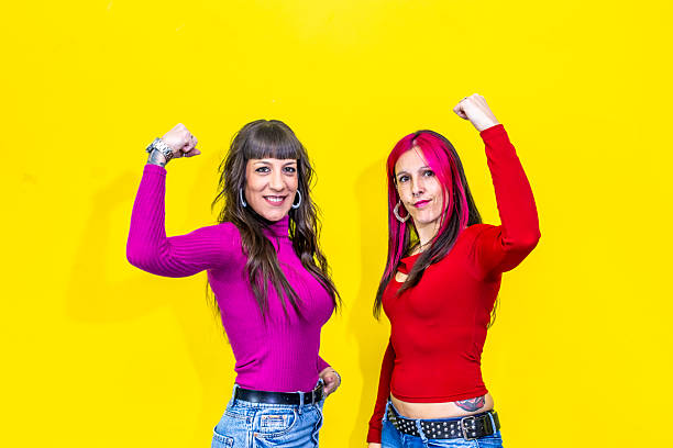 Two adult women showing strength and solidarity for women empowerment