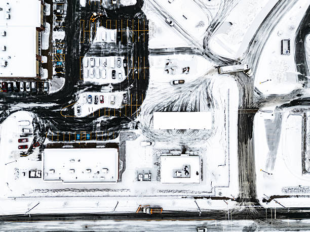 Aerial view of a retail/commercial plaza and highway.