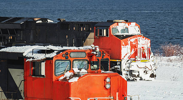 A diesel locomotive is covered in snow after an overnight trip through a snowstorm.