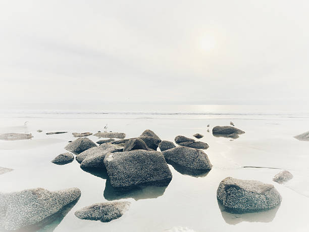 Stunning view at beach with coastal rocks and clear ocean water. High quality photo