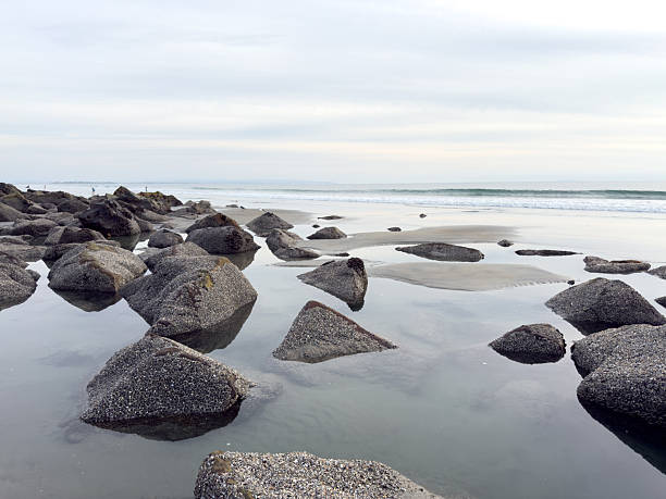 Stunning view at beach with coastal rocks and clear ocean water. High quality photo