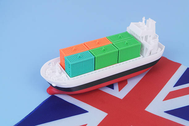 The British flag is falling apart in the wind on a dark turquoise background. Subjects of global powers. Flags of the whole world. Sand-like Flag, 3D sand painting