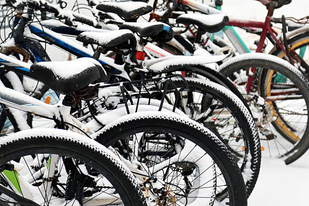 Colorful bicycles covered in snow