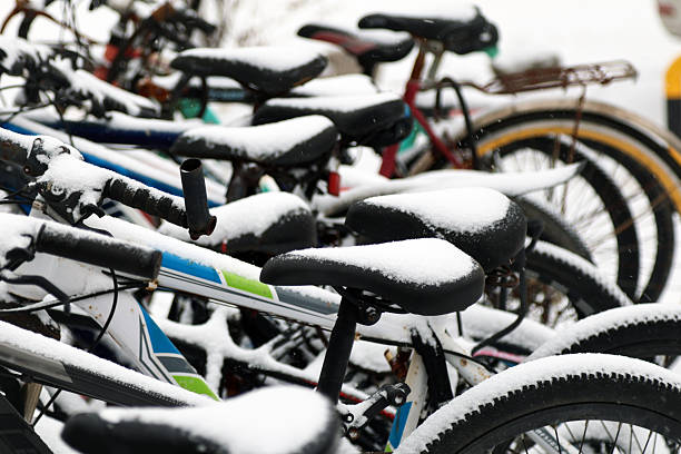 Colorful bicycles covered in snow