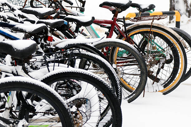 Colorful bicycles covered in snow