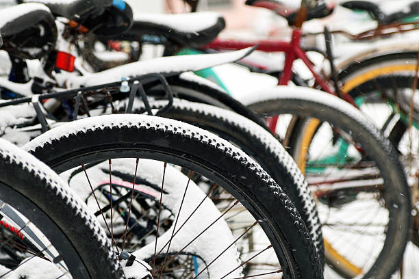 Colorful bicycles covered in snow