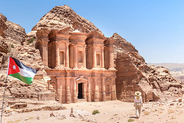 The Treasury, Petra, Jordan: The Treasury, also known as Al-Khazneh, is one of the most elaborate temples in Petra, a city of the Nabatean Kingdom inhabited by the Arabs in ancient times. The Treasury is carved out of sandstone.The structure is believed to have been the mausoleum of the Nabatean King Aretas IV in the 1st century AD. It is one of the most popular tourist attractions in Jordan.