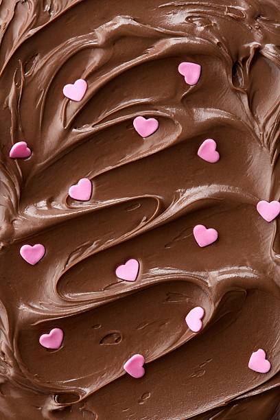 Chocolate hazelnut spread with heart spirnkles. Full frame pattern. Top view