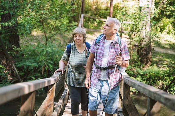 istock Senior Couple on a Nature Walk Surrounded by Greenery 2257781103