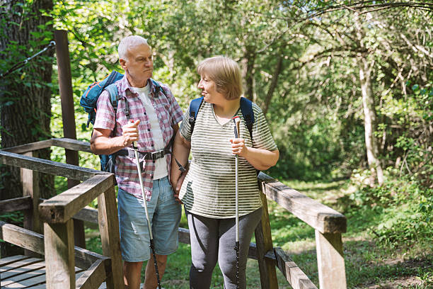 istock Mature Hikers Walking on a Scenic Woodland Path 2257781137