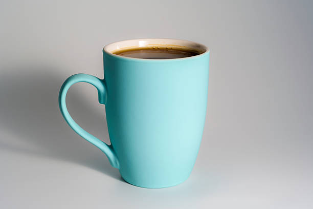 Coffee cup on table with curtain