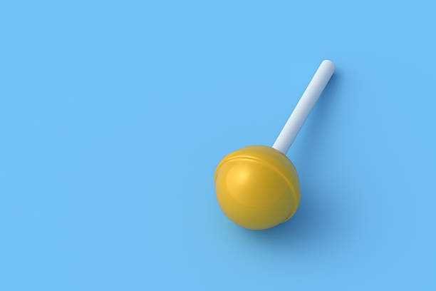 Yellow lollipop on blue background. Candy on stick. Copy space. 3d render