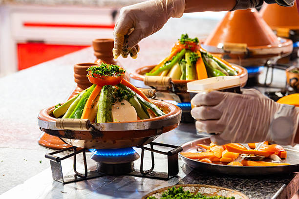 terracotta tagines, traditional plates, cookware, local shop in Marrakech's Medina, vibrant souks filled with traditional Moroccan detailed patterns and cultural artistry