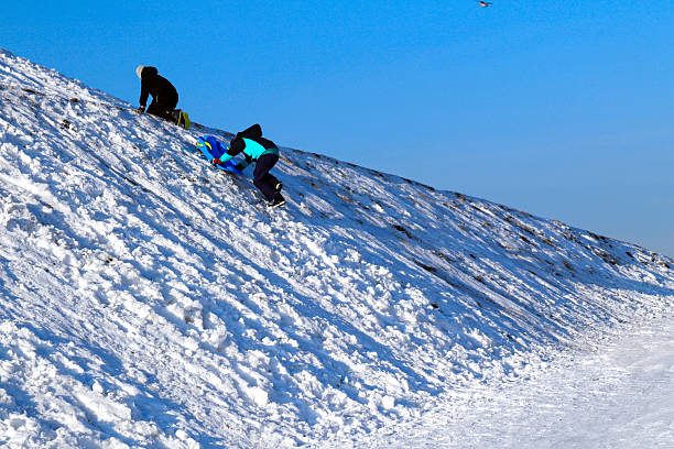 Platak, Croatia - December 28, 2025: Platak ski resort, surrounded by snowy slopes and forested mountains on a clear winter day, with ski infrastructure and visitors visible