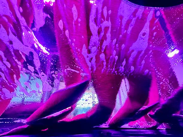 Car Wash Abstract background image. Pink and Purple Tones. Soap Suds on car window.
