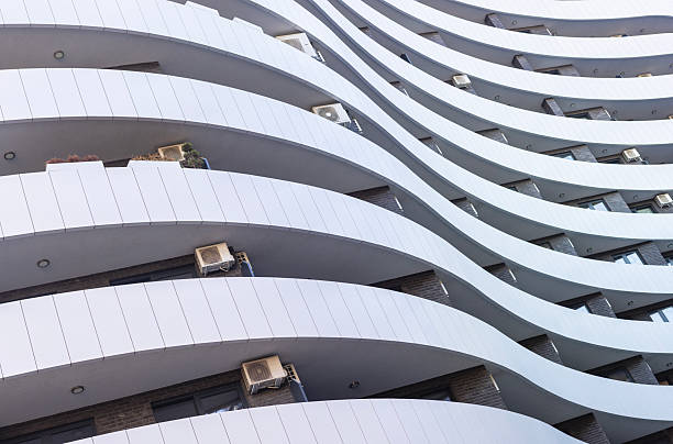 Contemporary exterior of a modern residential building with clean architectural lines and urban design. Perfect for real estate, architecture, and city lifestyle concepts.