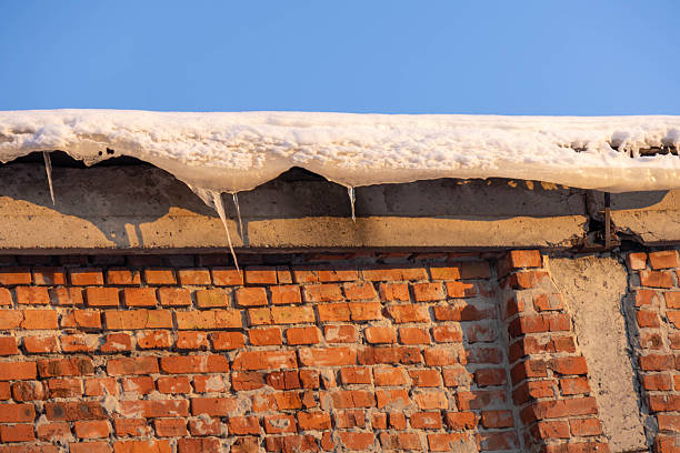 Snow covers an old table in winter, viewed from below. Khimki, Moscow region, Russia.
