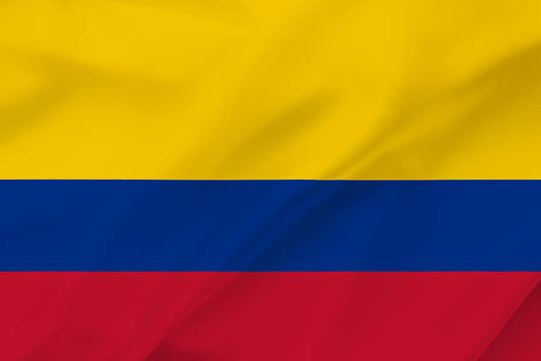 Colombia national flag waving textile background with yellow blue and red horizontal bands