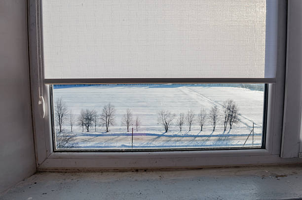 Looking Through window winter season snowing