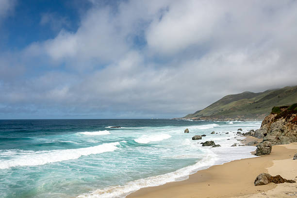 Low Clouds Begin To Engulf The Churning Coast Of Big Sur Shore