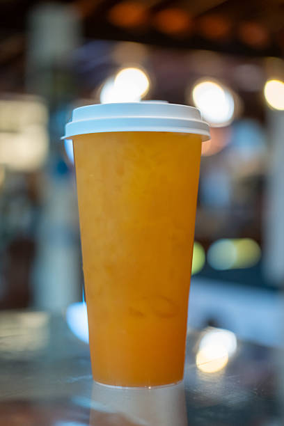 A cup of Orange juice on the table