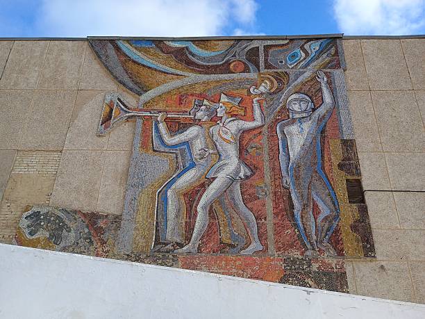 Soviet mosaic mural on Baikonur building in Kazakhstan, Russian-leased space town, Soviet art.