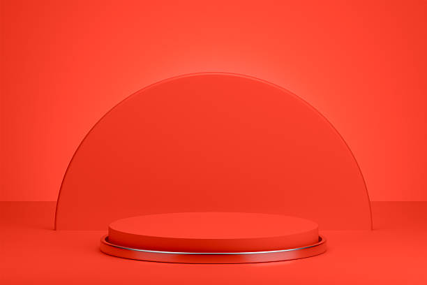 istock Red circular pedestal in an empty studio for product display and showcase 2257898976