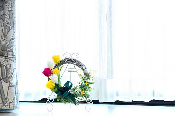 Colorful tulip wreath placed on a bay window.