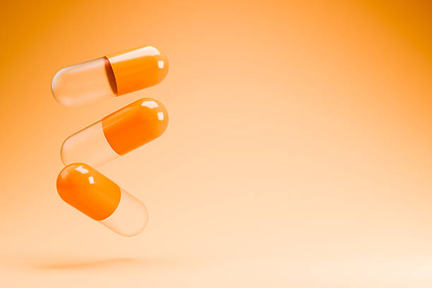 A capsule full of omega-3 fatty acid capsules. Healthcare and medicine concept.