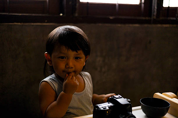 Toddler Is Playing With A Camera, Background for advertising and wallpaper in education and lifestyle scene.