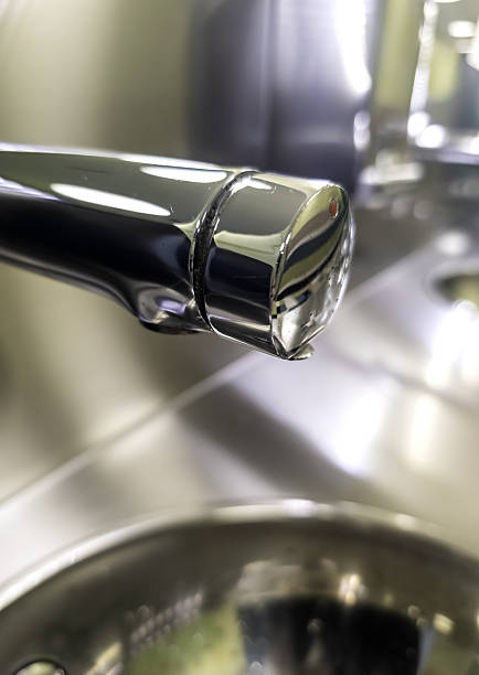 Detail of a water tap in a public restroom