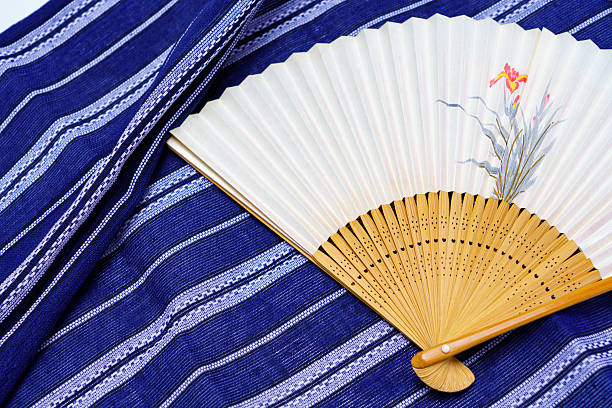 Japanese fan on traditional yukata fabric