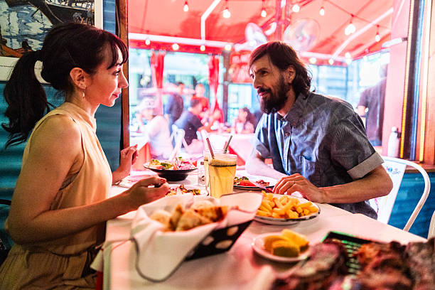 Couple enjoying lunch together in a restaurant in Caminito, Buenos Aires, Argentina